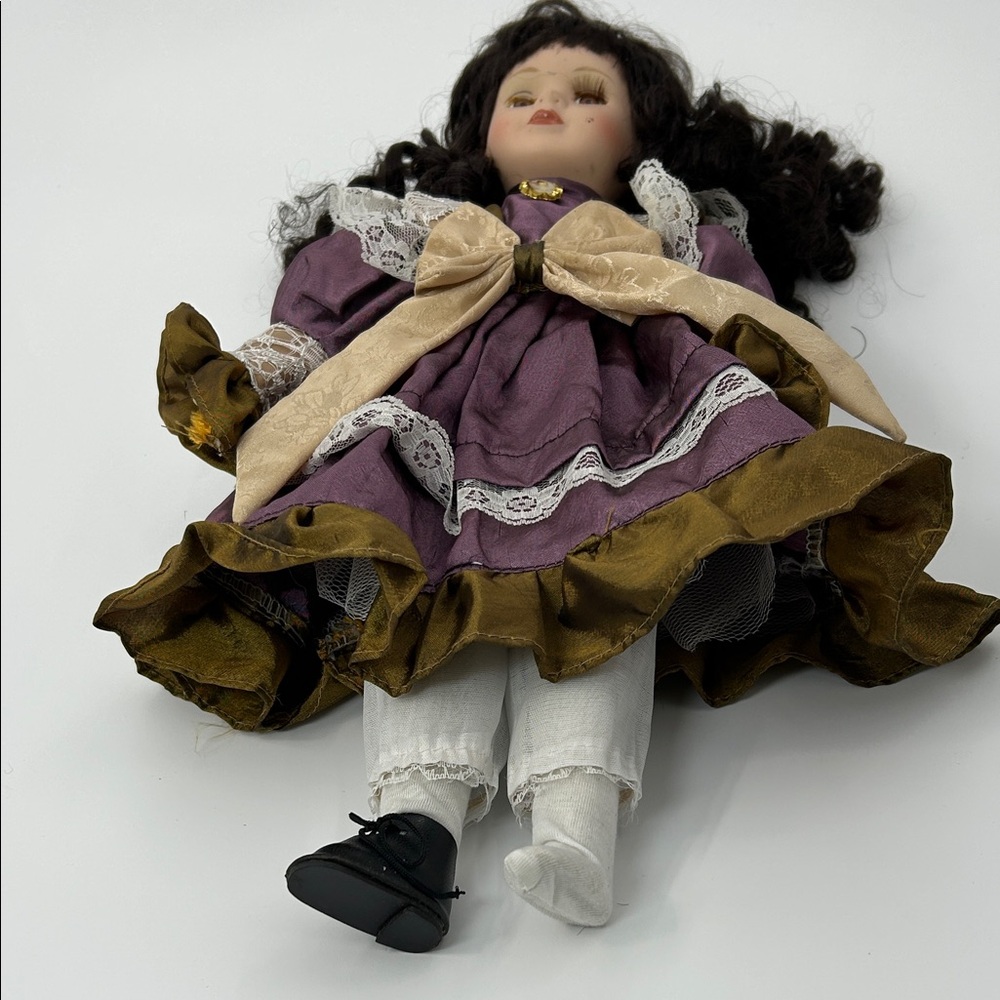Elegant Purple and Gold Doll with Lace Dress